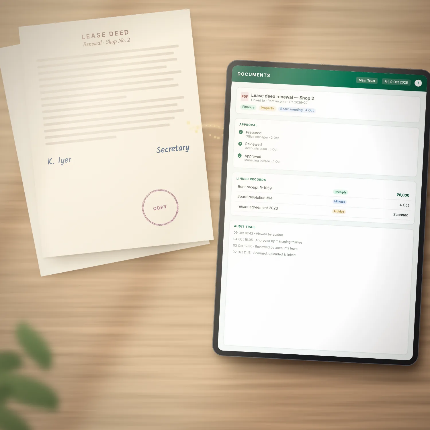 A signed paper lease deed beside a tablet showing it as a document record in ARAM ERP, with approvals, linked records and an audit trail